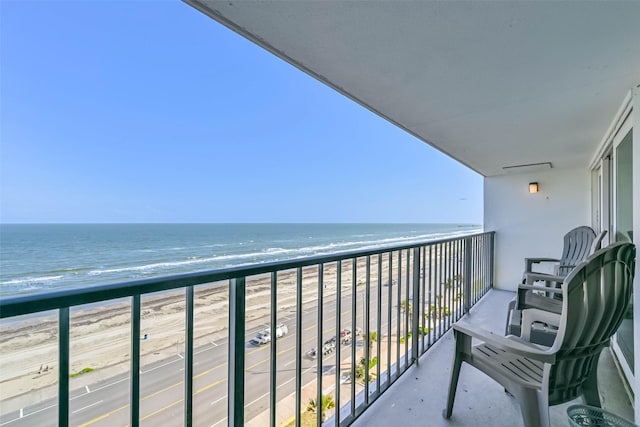 7310 Seawall Blvd Unit 907, Galveston, TX 77551 - balcony with view of water and beach