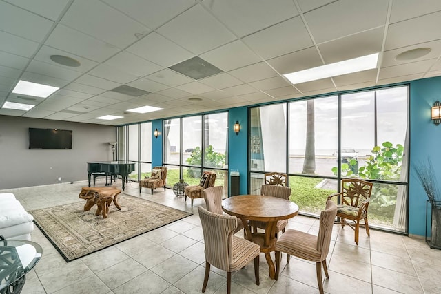7310 Seawall Blvd Unit 907, Galveston, TX 77551 - interior space with expansive windows, a drop ceiling, tile patterned floors, and baseboards