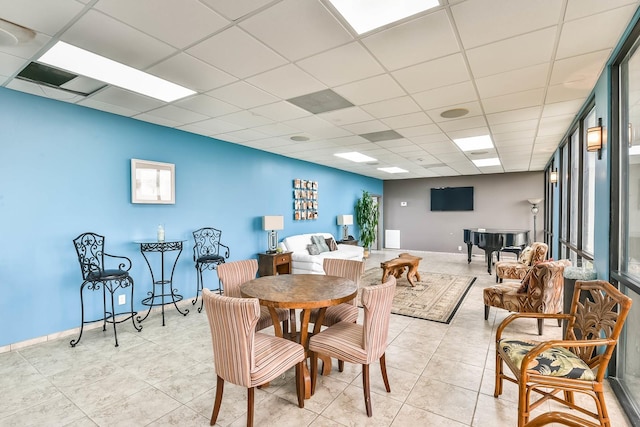 7310 Seawall Blvd Unit 907, Galveston, TX 77551 - dining area with a drop ceiling, light tile patterned floors, and baseboards