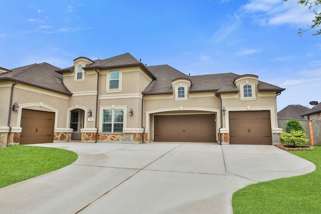 15411 Patten Forest Dr, Cypress, TX 77429 - french country home featuring stone siding, driveway, stucco siding, and an attached garage