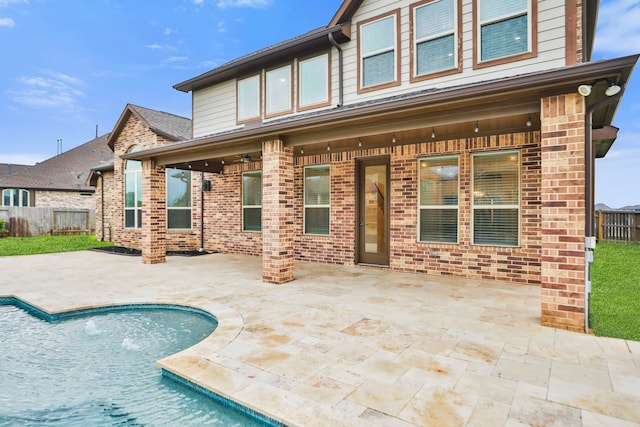 15411 Patten Forest Dr, Cypress, TX 77429 - rear view of property featuring brick siding, a patio area, and a shingled roof