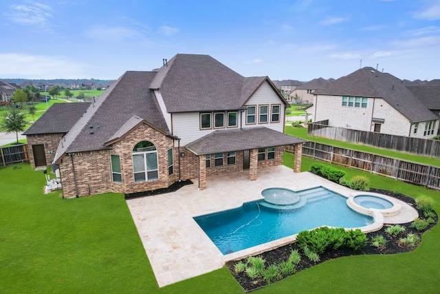 15411 Patten Forest Dr, Cypress, TX 77429 - view of swimming pool featuring a patio area, a pool with connected hot tub, and a residential view
