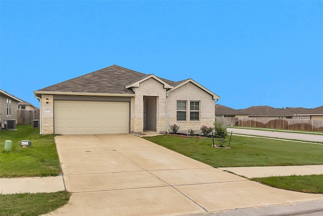 127 Barton Creek Dr, Huntsville, TX 77340 - ranch-style home featuring central AC, a garage, driveway, and brick siding