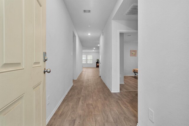 127 Barton Creek Dr, Huntsville, TX 77340 - hallway with wood finished floors, baseboards, and recessed lighting