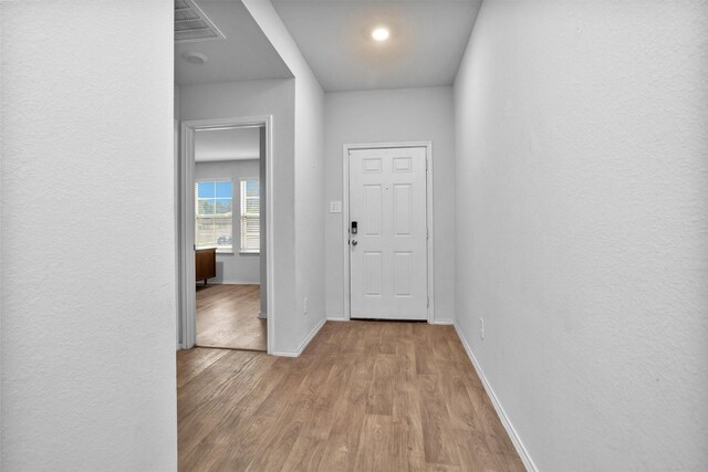 127 Barton Creek Dr, Huntsville, TX 77340 - hall with baseboards and wood finished floors