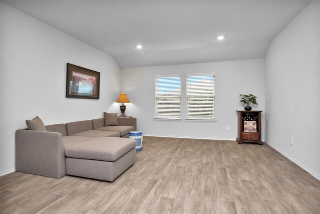 127 Barton Creek Dr, Huntsville, TX 77340 - living area with light wood finished floors, lofted ceiling, recessed lighting, and baseboards