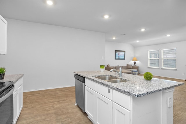 127 Barton Creek Dr, Huntsville, TX 77340 - kitchen featuring a sink, stainless steel appliances, open floor plan, white cabinetry, and an island with sink