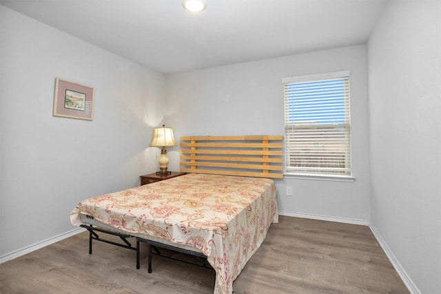 127 Barton Creek Dr, Huntsville, TX 77340 - bedroom featuring wood finished floors and baseboards