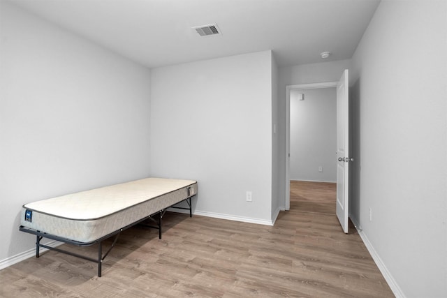 127 Barton Creek Dr, Huntsville, TX 77340 - bedroom with wood finished floors and baseboards