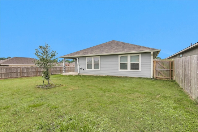 127 Barton Creek Dr, Huntsville, TX 77340 - back of house featuring a shingled roof