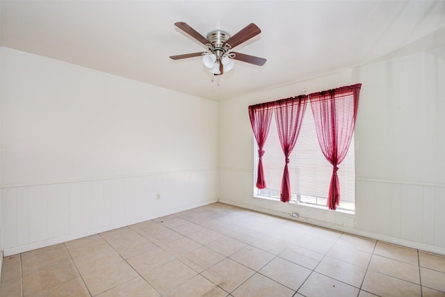 4124 Belle Park Dr, Houston, TX 77072 - unfurnished room featuring a ceiling fan, wainscoting, and light tile patterned flooring