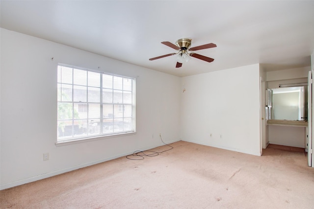 4124 Belle Park Dr, Houston, TX 77072 - spare room featuring light carpet, a ceiling fan, and baseboards
