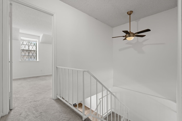 10320 Hammerly Blvd Unit 171, Houston, TX 77043 - stairs with carpet, a textured ceiling, and ceiling fan