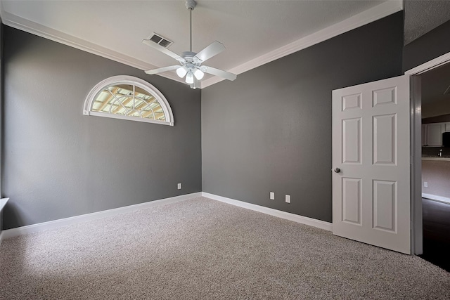 24214 Soft Pine Dr, Huffman, TX 77336 - unfurnished room featuring a ceiling fan, carpet floors, baseboards, and crown molding