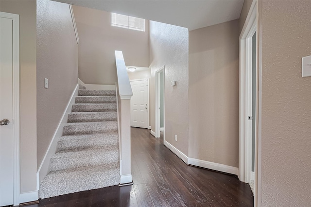 24214 Soft Pine Dr, Huffman, TX 77336 - stairs featuring hardwood / wood-style flooring, a textured wall, and baseboards