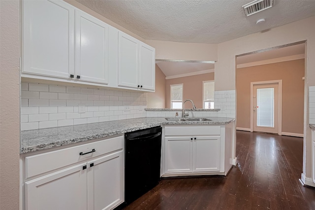 24214 Soft Pine Dr, Huffman, TX 77336 - kitchen featuring black dishwasher, a sink, tasteful backsplash, white cabinetry, and dark wood-style flooring