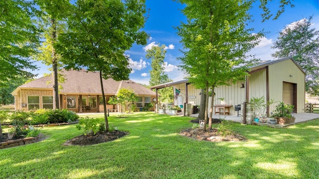 634 Carriage View Ln, Huffman, TX 77336 - view of grassy yard featuring an outdoor structure