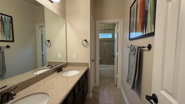 634 Carriage View Ln, Huffman, TX 77336 - full bath with double vanity, baseboards, and tub / shower combination