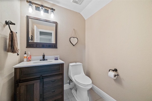 8002 Elm Wood Ct, Baytown, TX 77523 - half bathroom featuring vanity, toilet, tile patterned floors, and vaulted ceiling