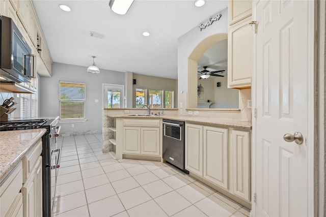 8002 Elm Wood Ct, Baytown, TX 77523 - kitchen with appliances with stainless steel finishes, ceiling fan, a sink, open shelves, and light tile patterned flooring