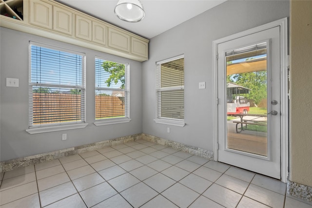 8002 Elm Wood Ct, Baytown, TX 77523 - spare room with light tile patterned floors and plenty of natural light