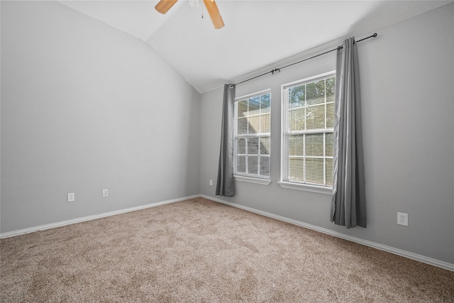 8002 Elm Wood Ct, Baytown, TX 77523 - carpeted spare room featuring vaulted ceiling, a ceiling fan, and baseboards