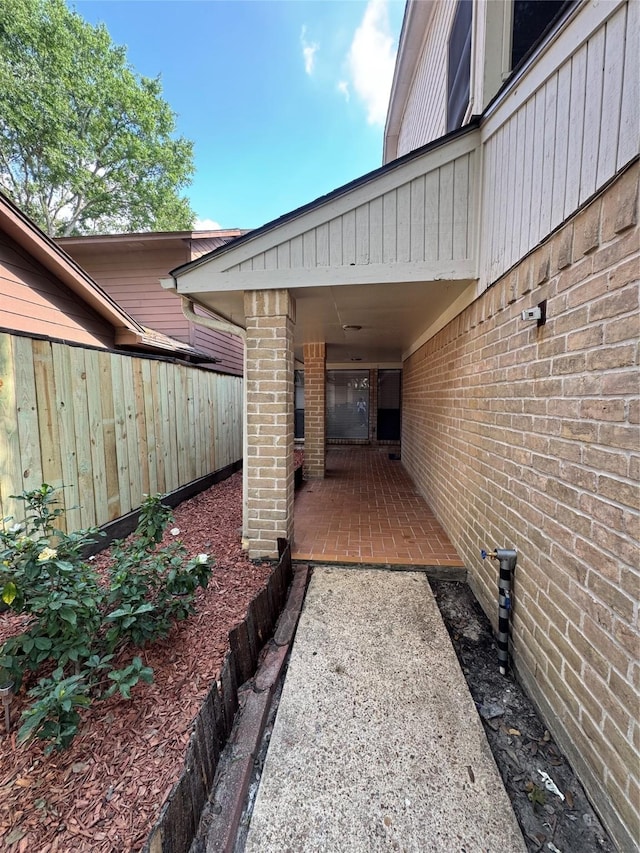 8007 E Oakwood Ct, Houston, TX 77040 - exterior space with brick siding and a patio area