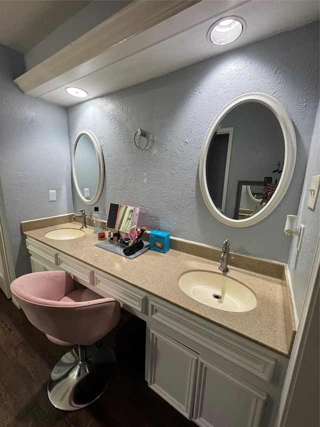 8007 E Oakwood Ct, Houston, TX 77040 - bathroom with double vanity and wood finished floors