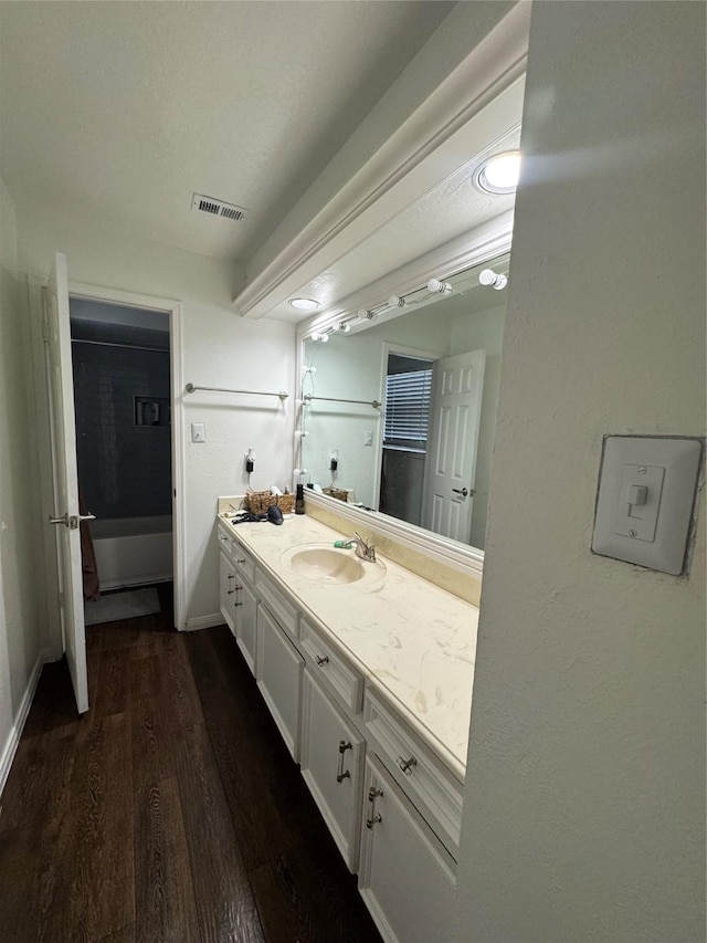 8007 E Oakwood Ct, Houston, TX 77040 - bathroom featuring vanity, wood finished floors, and baseboards