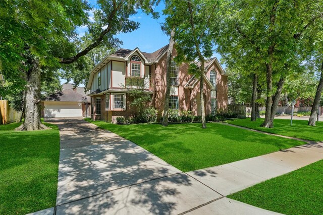 1017 Oak Knoll Ct, Sugar Land, TX 77498 - view of front facade with brick siding, driveway, and a detached garage
