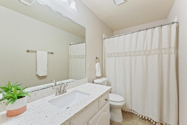 1017 Oak Knoll Ct, Sugar Land, TX 77498 - bathroom with toilet, vanity, and a textured ceiling