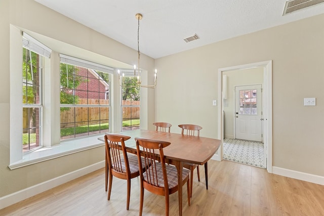 1017 Oak Knoll Ct, Sugar Land, TX 77498 - dining room with plenty of natural light and light wood-style flooring