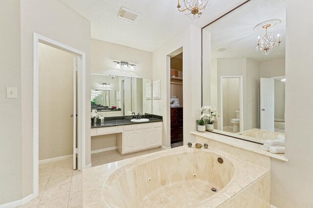 1017 Oak Knoll Ct, Sugar Land, TX 77498 - full bathroom with a chandelier, vanity, a jetted tub, toilet, and tile patterned floors