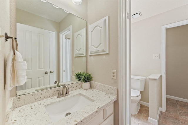 1017 Oak Knoll Ct, Sugar Land, TX 77498 - bathroom featuring toilet, vanity, and tile patterned floors