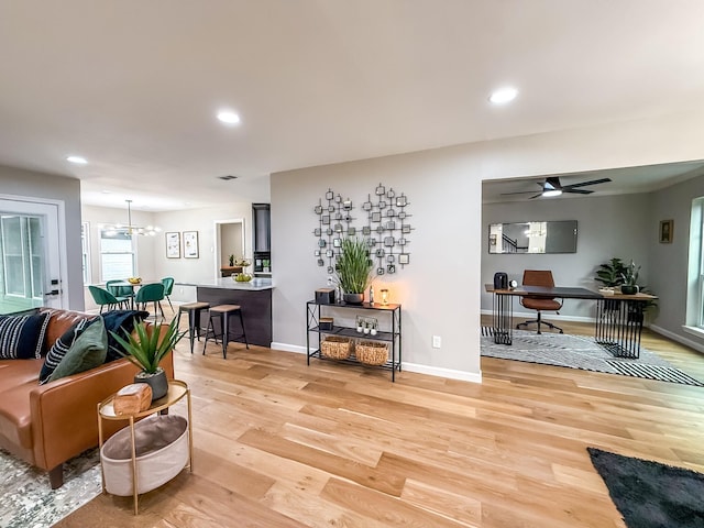 2106 Teague Rd, Houston, TX 77080 - living room with light wood finished floors, an office area, recessed lighting, baseboards, and a chandelier