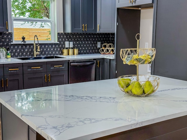 2106 Teague Rd, Houston, TX 77080 - kitchen featuring dishwashing machine, a sink, decorative backsplash, and light stone countertops