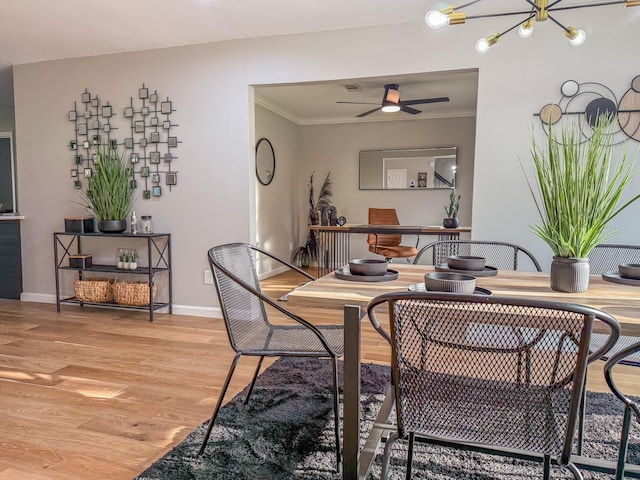 2106 Teague Rd, Houston, TX 77080 - dining space with light wood-style floors, crown molding, a chandelier, baseboards, and ceiling fan
