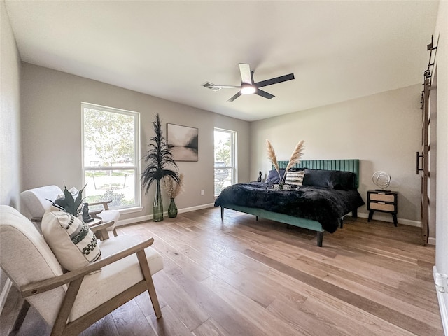 2106 Teague Rd, Houston, TX 77080 - bedroom with baseboards, light wood finished floors, and ceiling fan