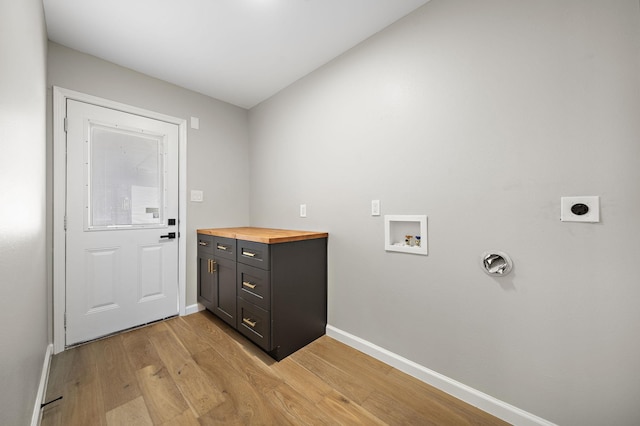 2106 Teague Rd, Houston, TX 77080 - washroom with electric dryer hookup, washer hookup, light wood finished floors, and baseboards