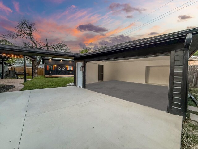 2106 Teague Rd, Houston, TX 77080 - garage at dusk with driveway