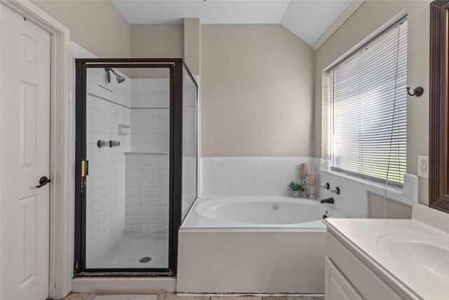 3238 Bodine Dr, Pearland, TX 77584 - full bath featuring a garden tub, a shower stall, vanity, and vaulted ceiling