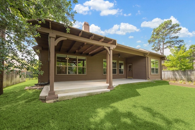 107 N Greenprint Cir, Tomball, TX 77375 - back of property featuring a patio, ceiling fan, and a chimney