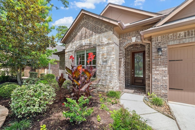 107 N Greenprint Cir, Tomball, TX 77375 - property entrance with stone siding, brick siding, and an attached garage