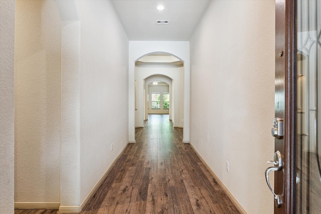 107 N Greenprint Cir, Tomball, TX 77375 - corridor featuring arched walkways, wood finished floors, and baseboards
