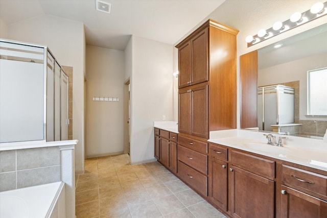 107 N Greenprint Cir, Tomball, TX 77375 - full bathroom featuring a stall shower, double vanity, a bath, and tile patterned flooring