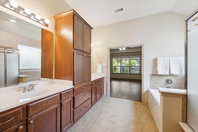 107 N Greenprint Cir, Tomball, TX 77375 - bathroom featuring tile patterned floors, vanity, a bath, and lofted ceiling