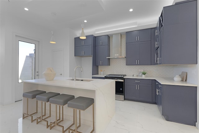 2933 El Fenice Ln, Houston, TX 77057 - kitchen featuring stainless steel electric range oven, a sink, wall chimney range hood, tasteful backsplash, and a kitchen bar
