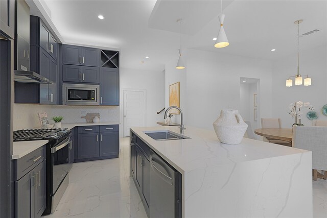 2933 El Fenice Ln, Houston, TX 77057 - kitchen with appliances with stainless steel finishes, tasteful backsplash, light marble finish floors, a kitchen island with sink, and recessed lighting