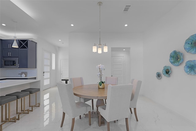 2933 El Fenice Ln, Houston, TX 77057 - dining room featuring light marble finish flooring, recessed lighting, a chandelier, and baseboards