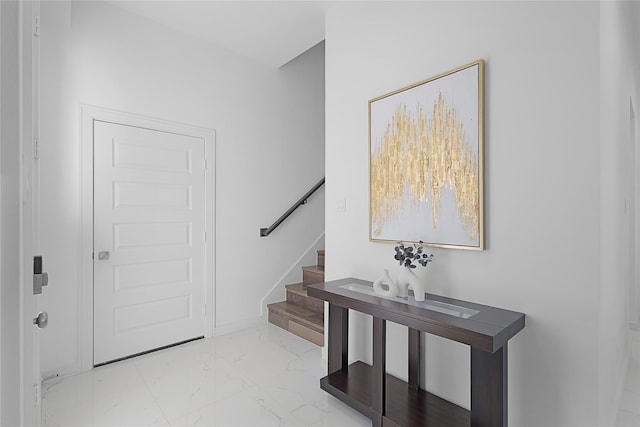 2933 El Fenice Ln, Houston, TX 77057 - entryway with light marble finish flooring, stairway, and baseboards